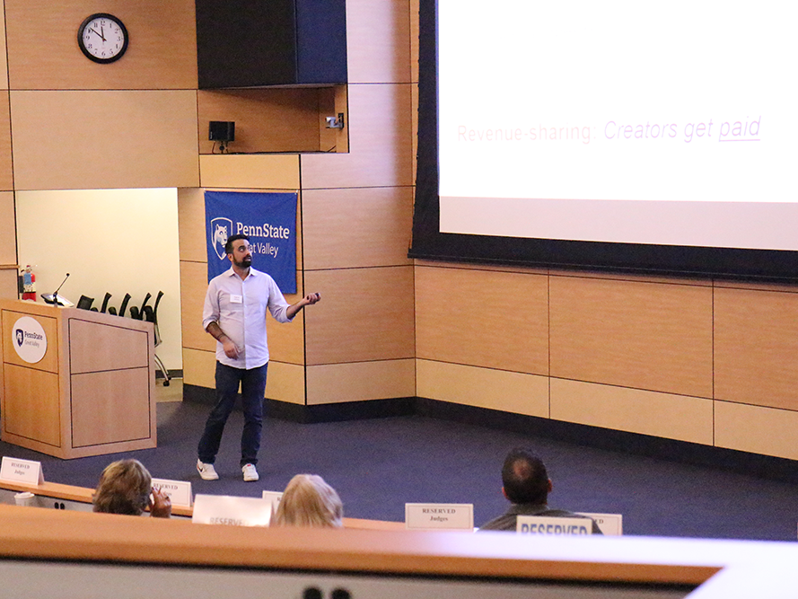 A competitor pitching his idea at the Lion Cage event