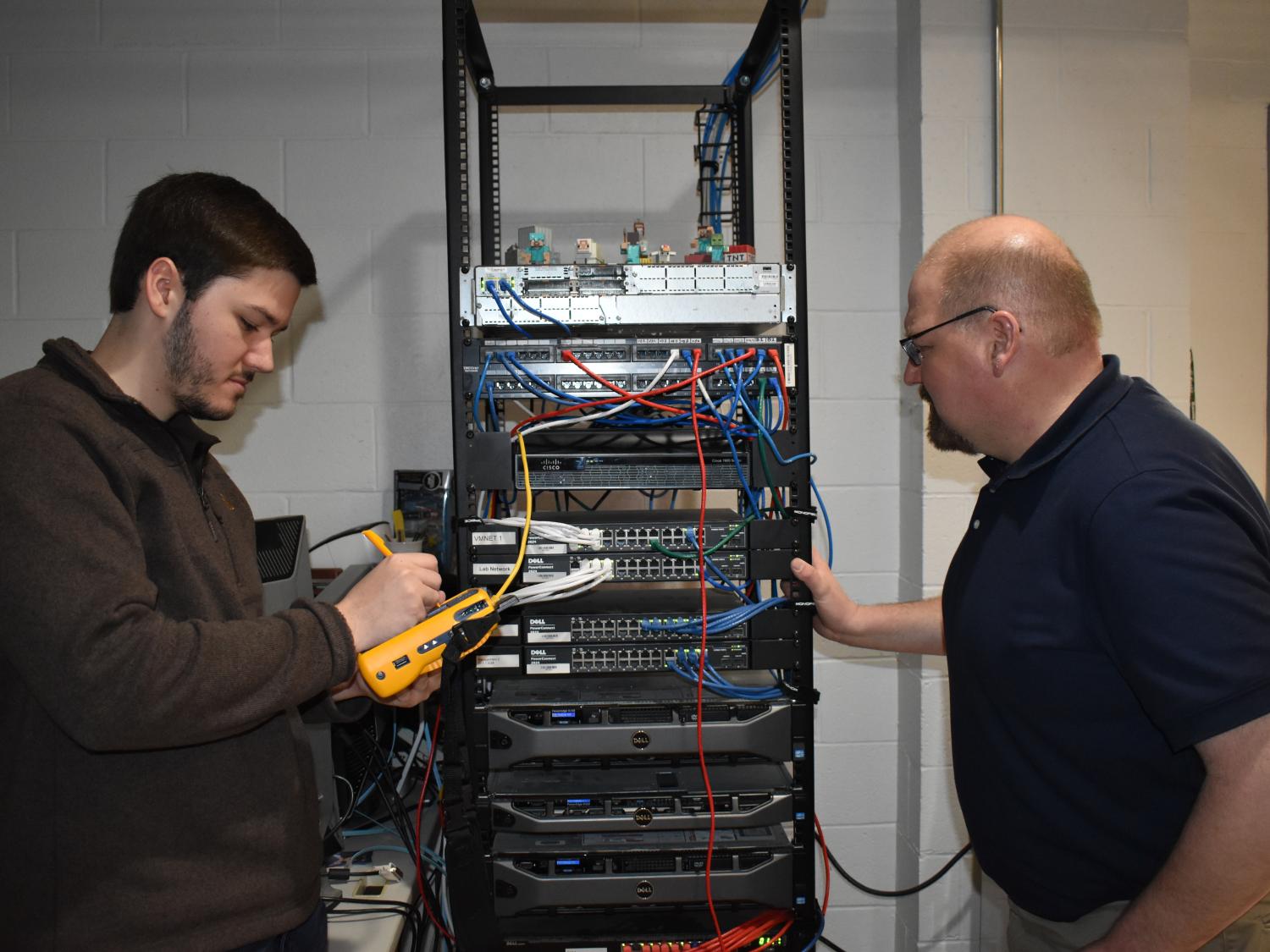 IST graduate CJ Seitz, left, and IST Program Leader Jason Long. 