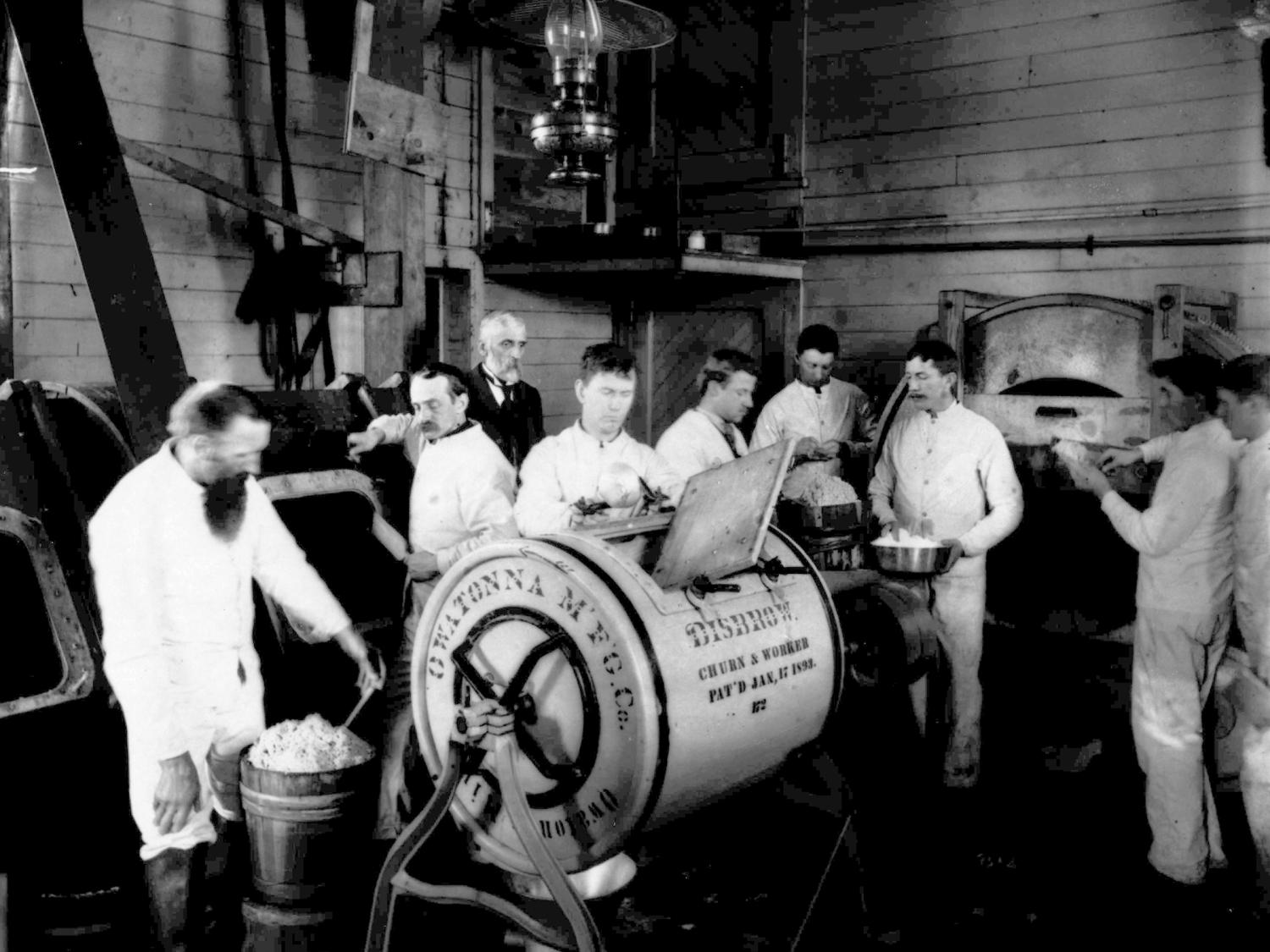 Short course students separating cream at Penn State, 1894