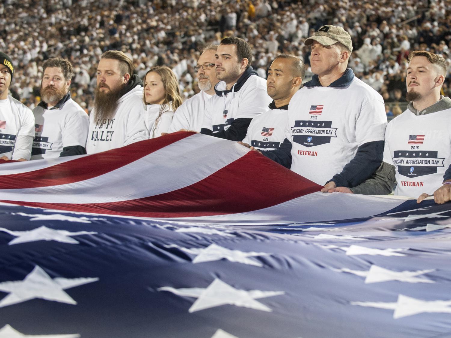 Veterans hold flag