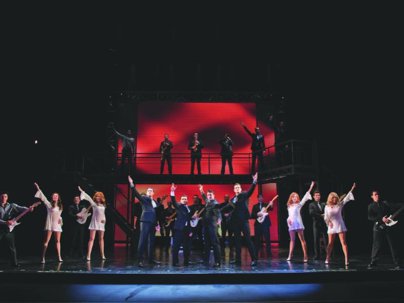 The cast of "Jersey Boys" takes the stage for a finale song.