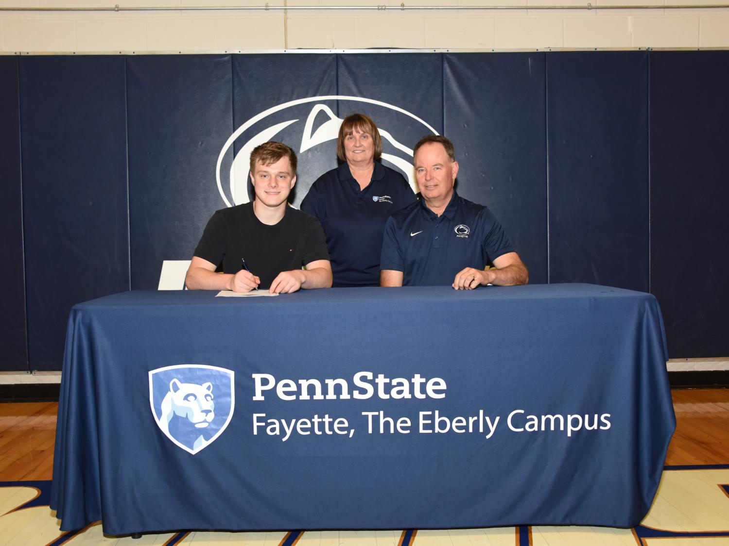 Josh Sterbutzel; Rita Gumbert, Volunteer Golf Coach; Dave Gumbert, Head Golf Coach.