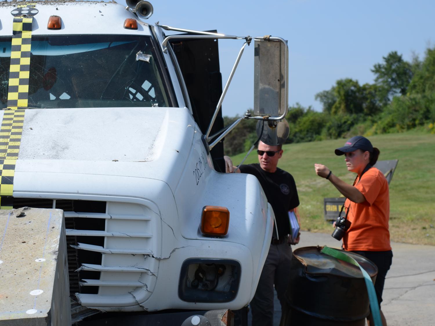 Staff inspecting crashed truck