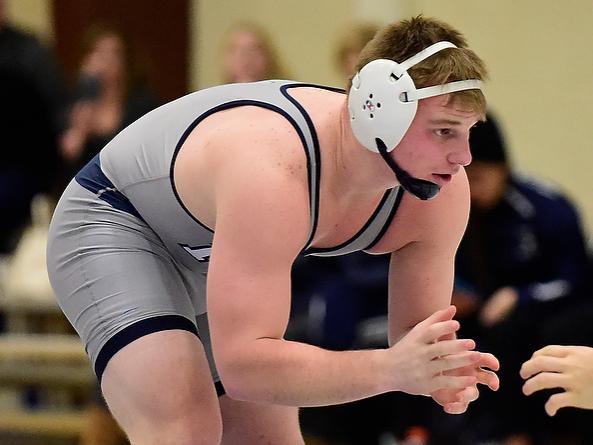 Penn State Behrend wrestler Jake Paulson competes in a match.