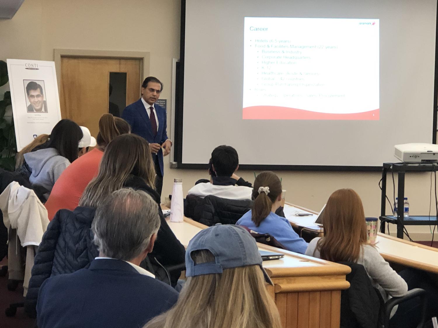 Javig Baig teaching Hospitality Management students in class