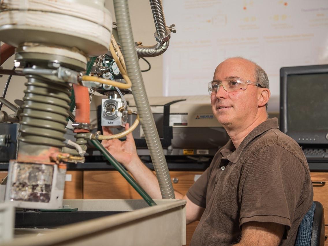 Jay Amicangelo, professor of chemistry at Penn State Behrend, works in his lab at the college.