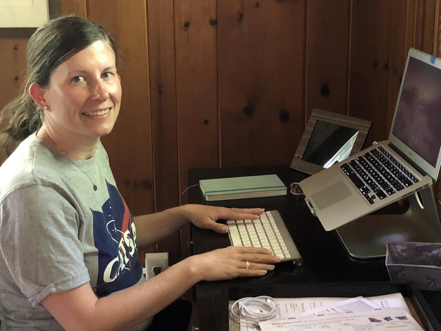 Jennifer Baka, assistant professor of geography at Penn State, works from her home office.