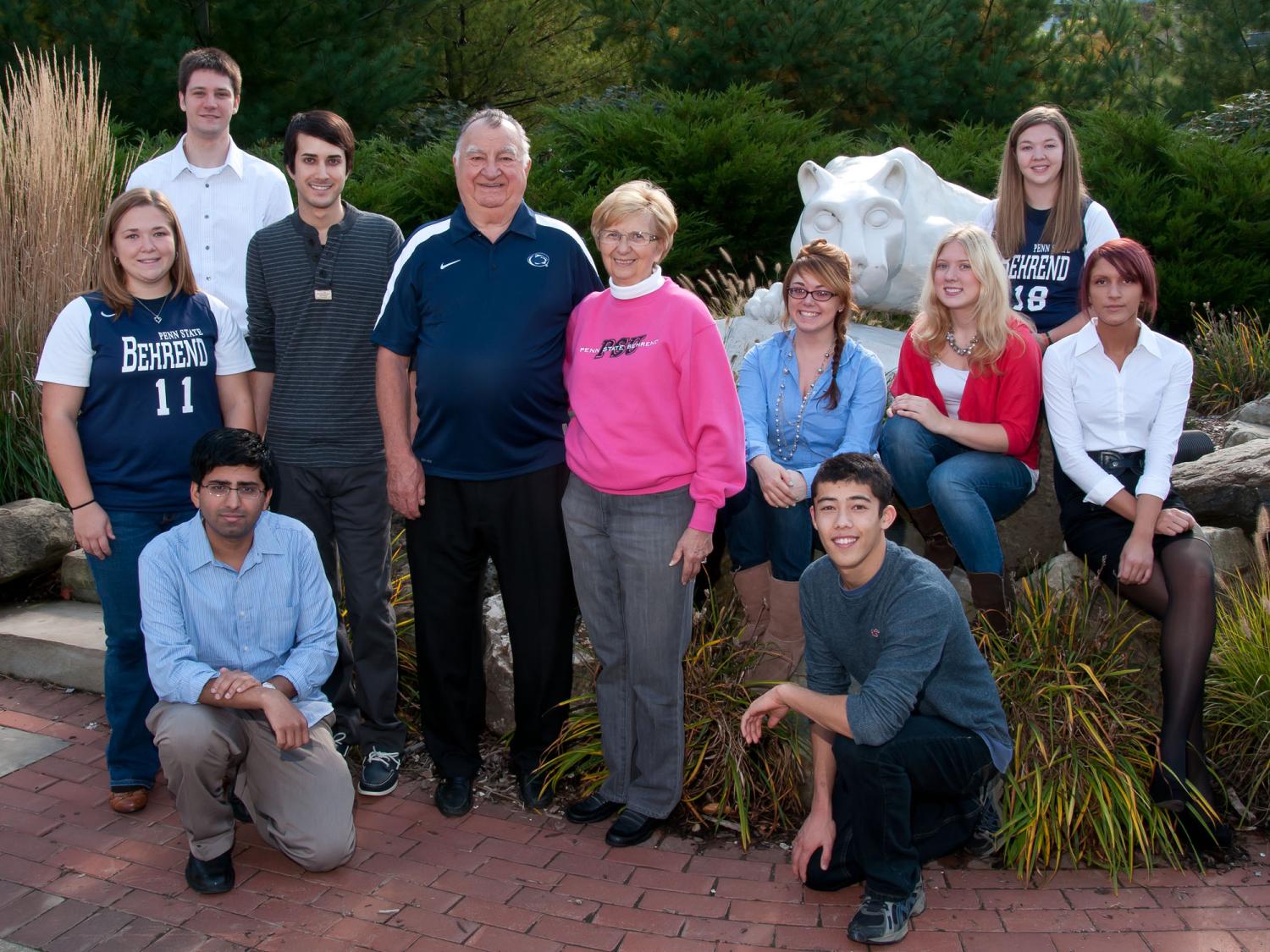 Joe and Isabel Prischak pose with scholarship recipients at the Lion Shrine at Penn State Behrend.