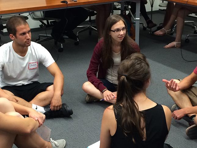 Small group of students in informal discussion.