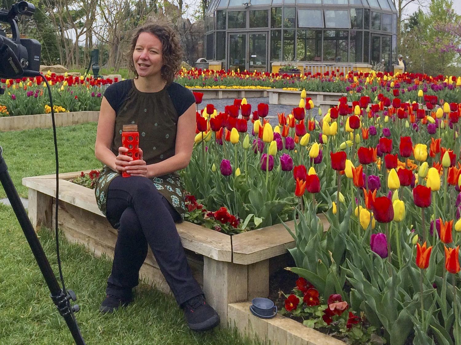 Kami Dvorakova films a guided meditation amid flowers at The Arboretum 