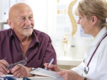 A man talks with his physician.