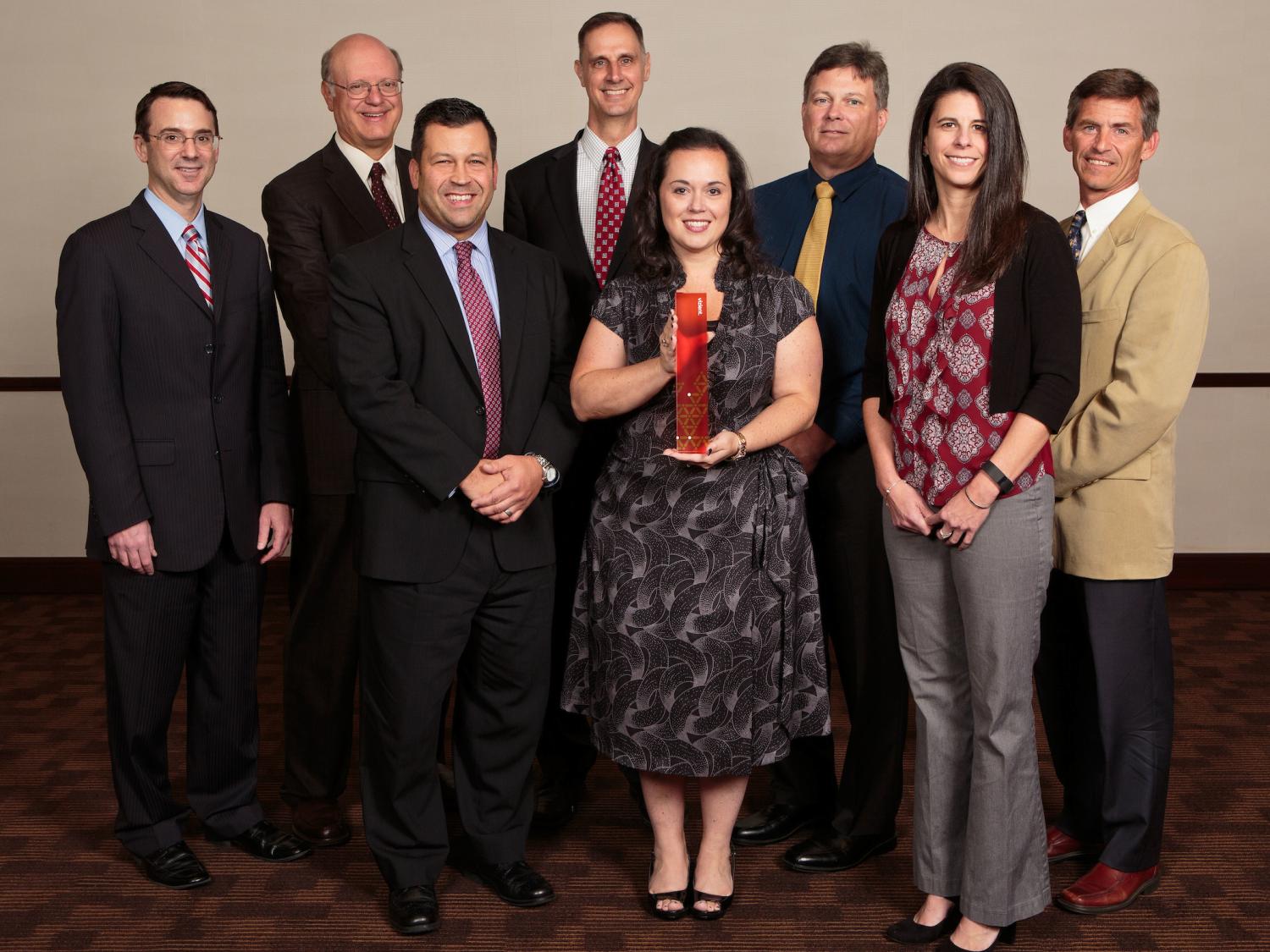 Eight representatives of Hershey Medical Center pose for a photo.