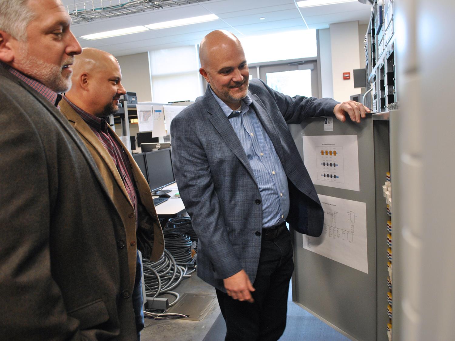 three men in engineering lab