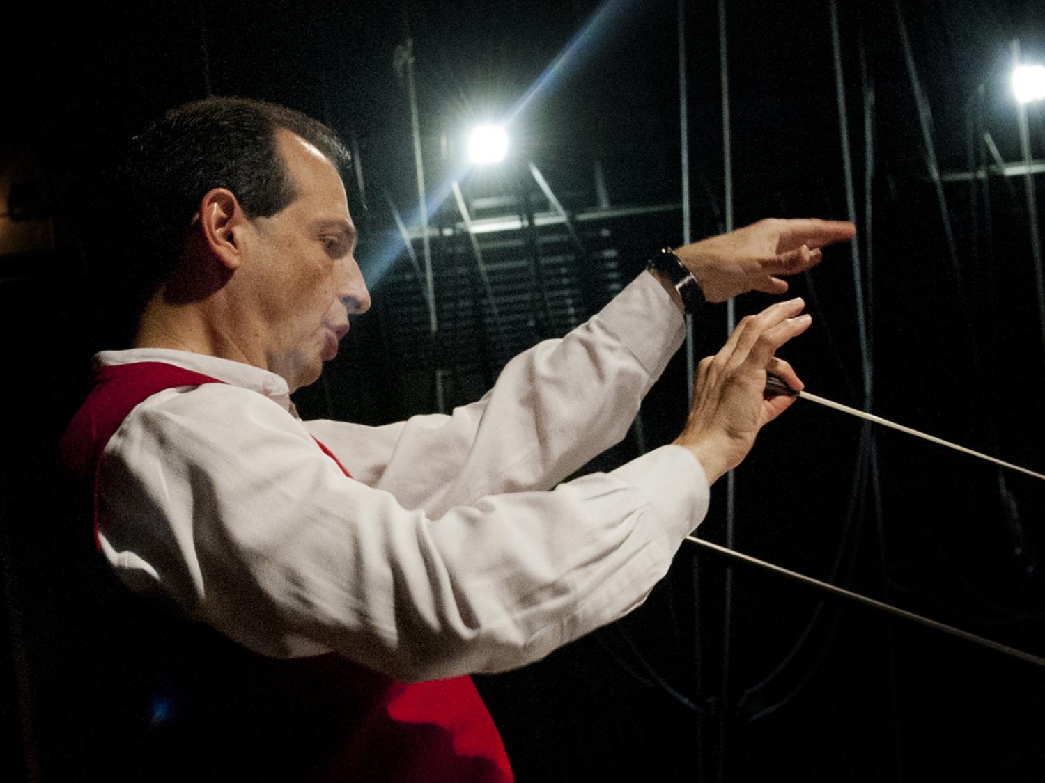 Conductor leads Bernstein MASS rehearsal