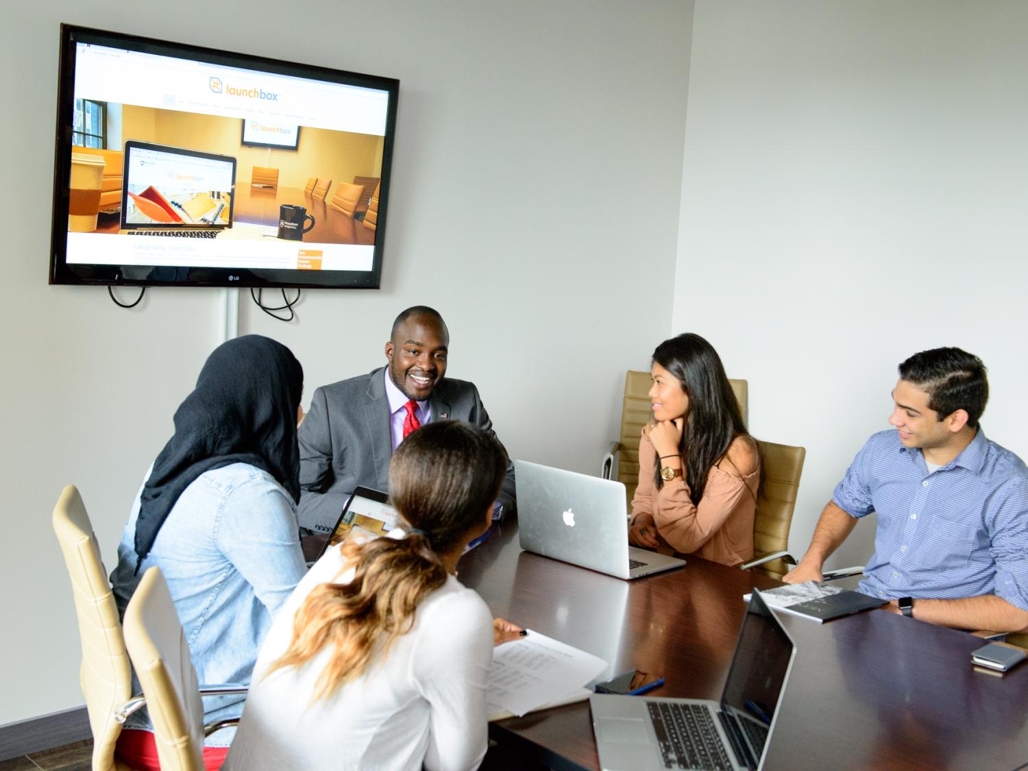 Individuals sitting around a table