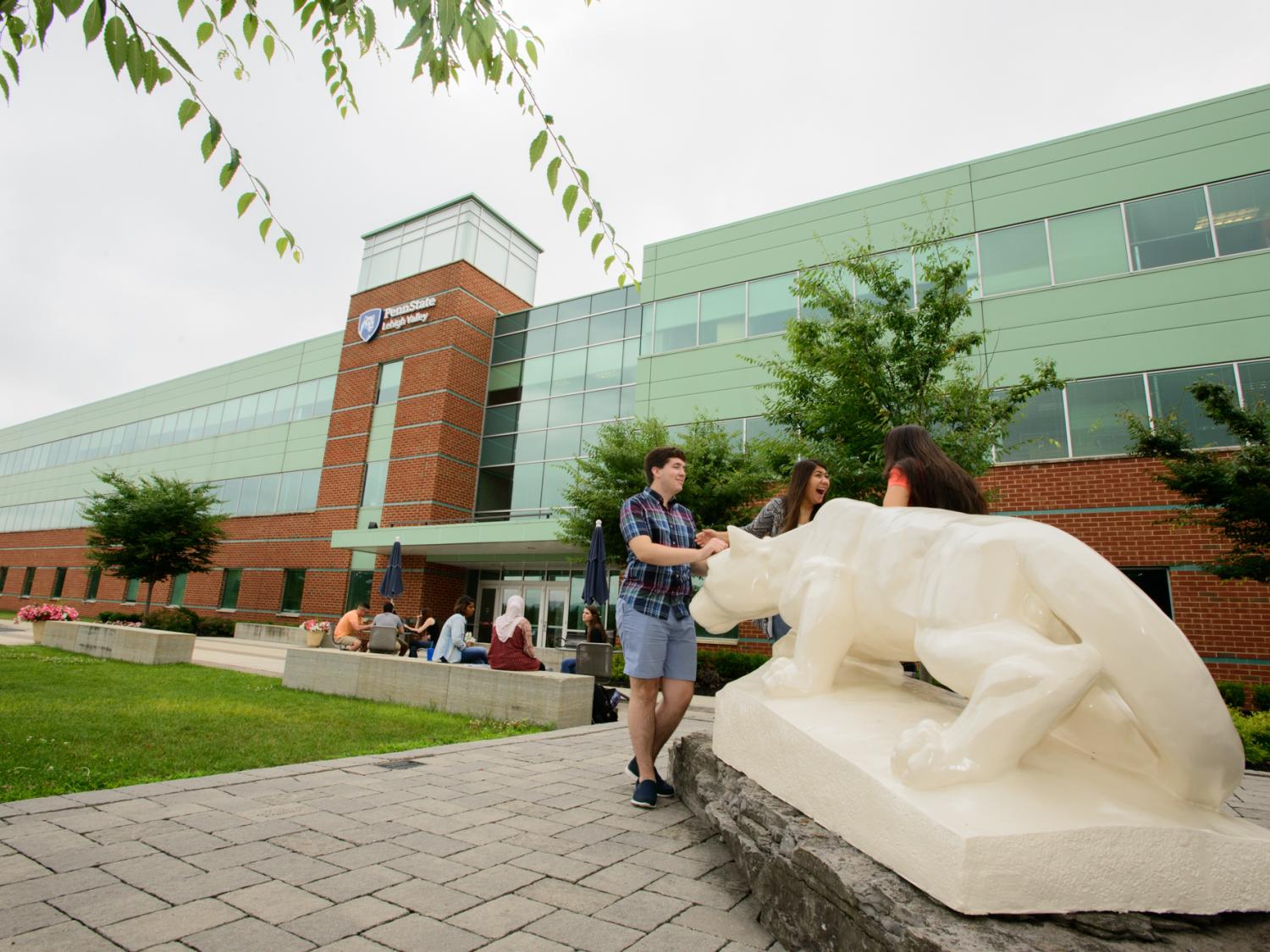 students by Lehigh Valley's Nittany Lion Shrine outside of building