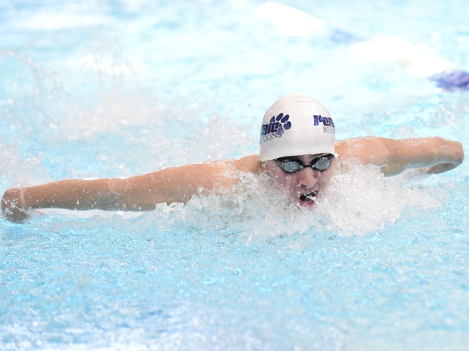 Penn State Behrend swimmer Liam Watterson swims in a race.