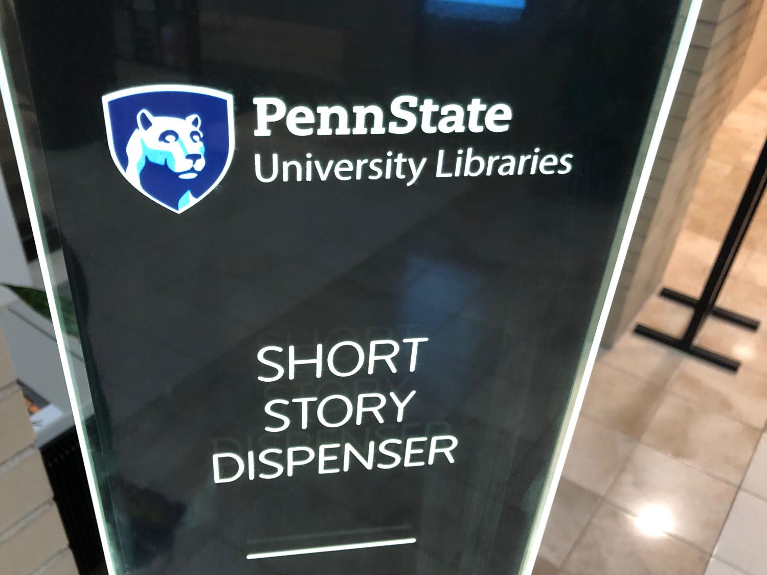 photo of back-painted, backlit glass sign with words Penn State University Libraries Short Story Dispenser