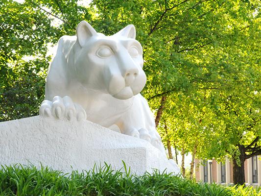 The Lion Shrine sits on the campus among trees