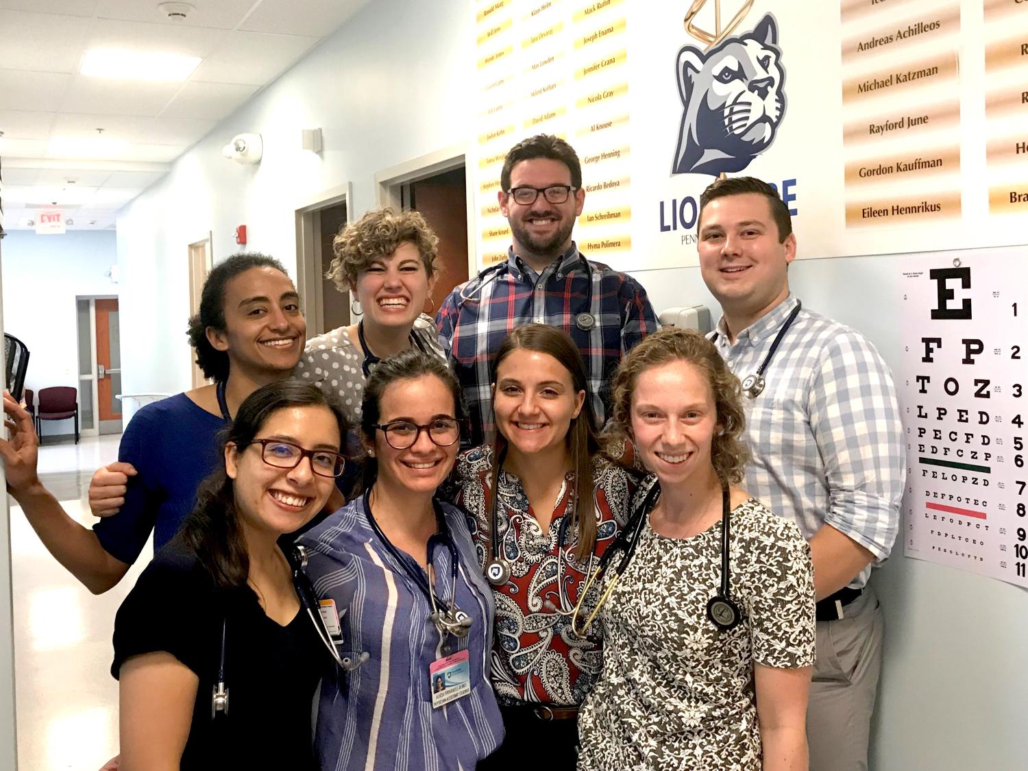 A group of people smile for a photo