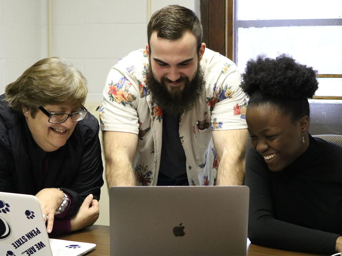 Three students collaborating on Pittsburgh Literature Project