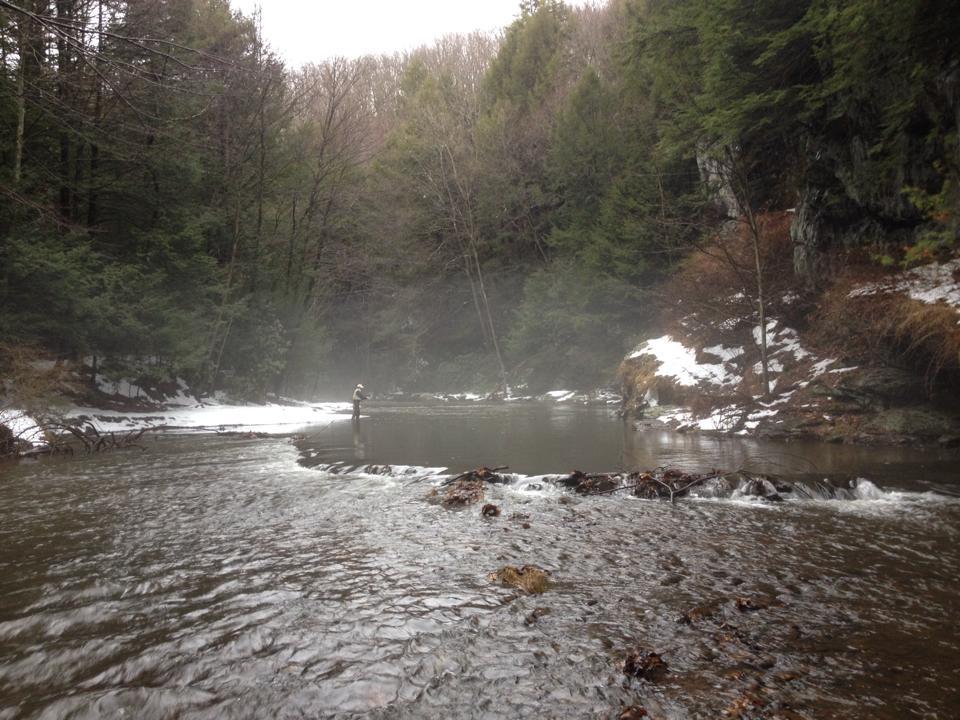 a landscape shot of a fisherman in the Little Schuylkill River