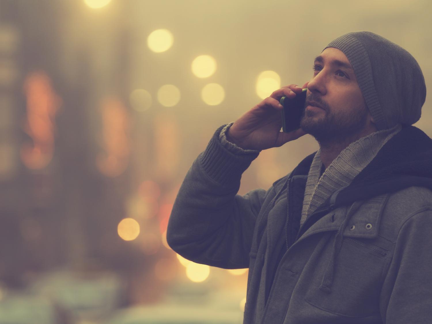 man in hat, cell phone