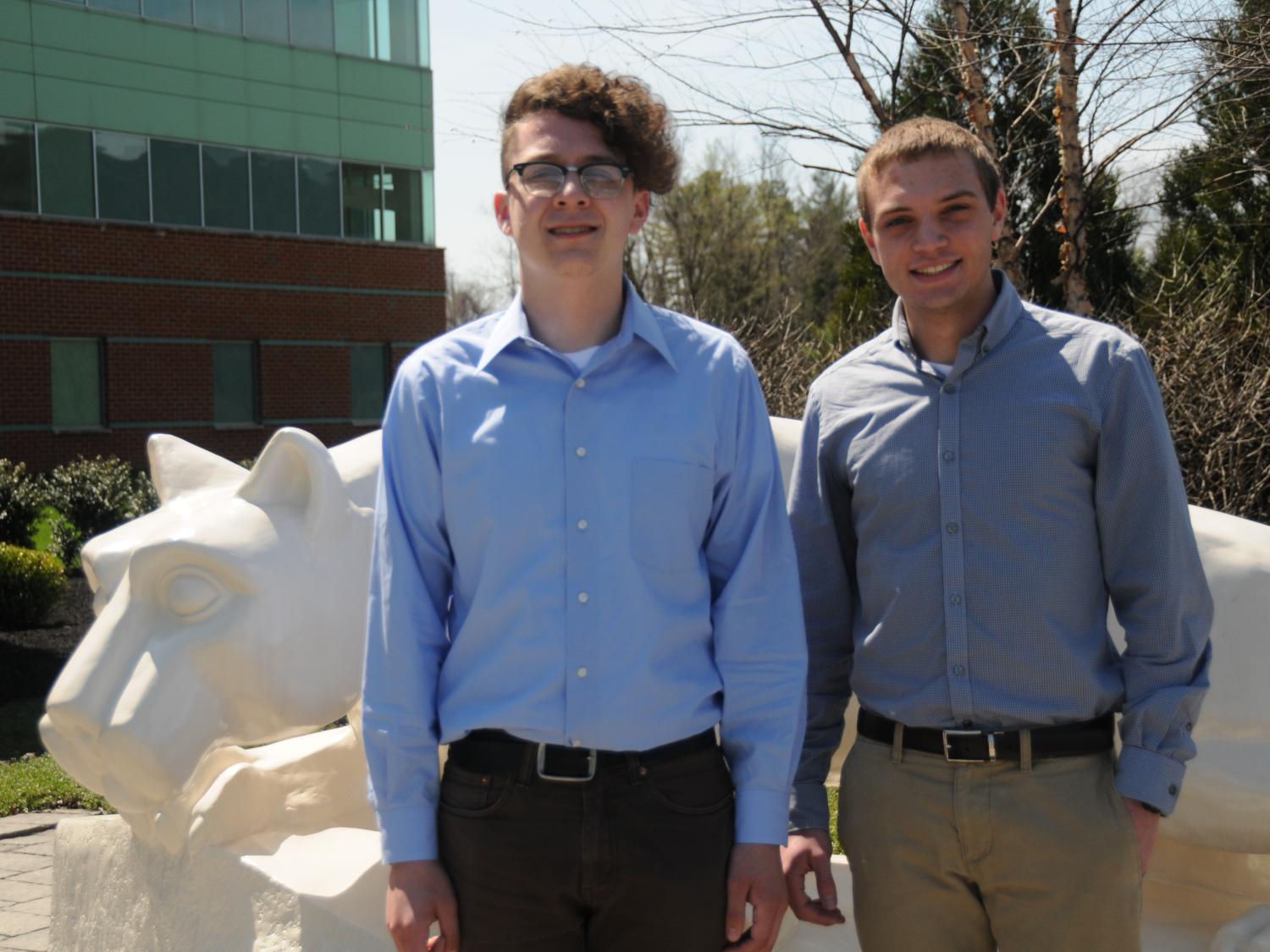 Two students in front of Lion Shrine