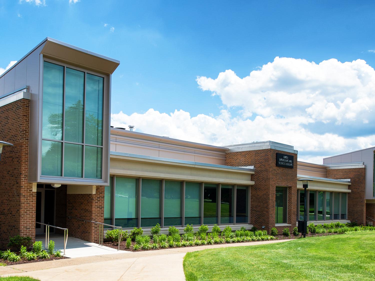 The brick-and-glass Michael Baker Building on a summer day.
