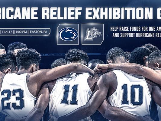 Penn State basketball players in a huddle with their arms on each others' shoulders