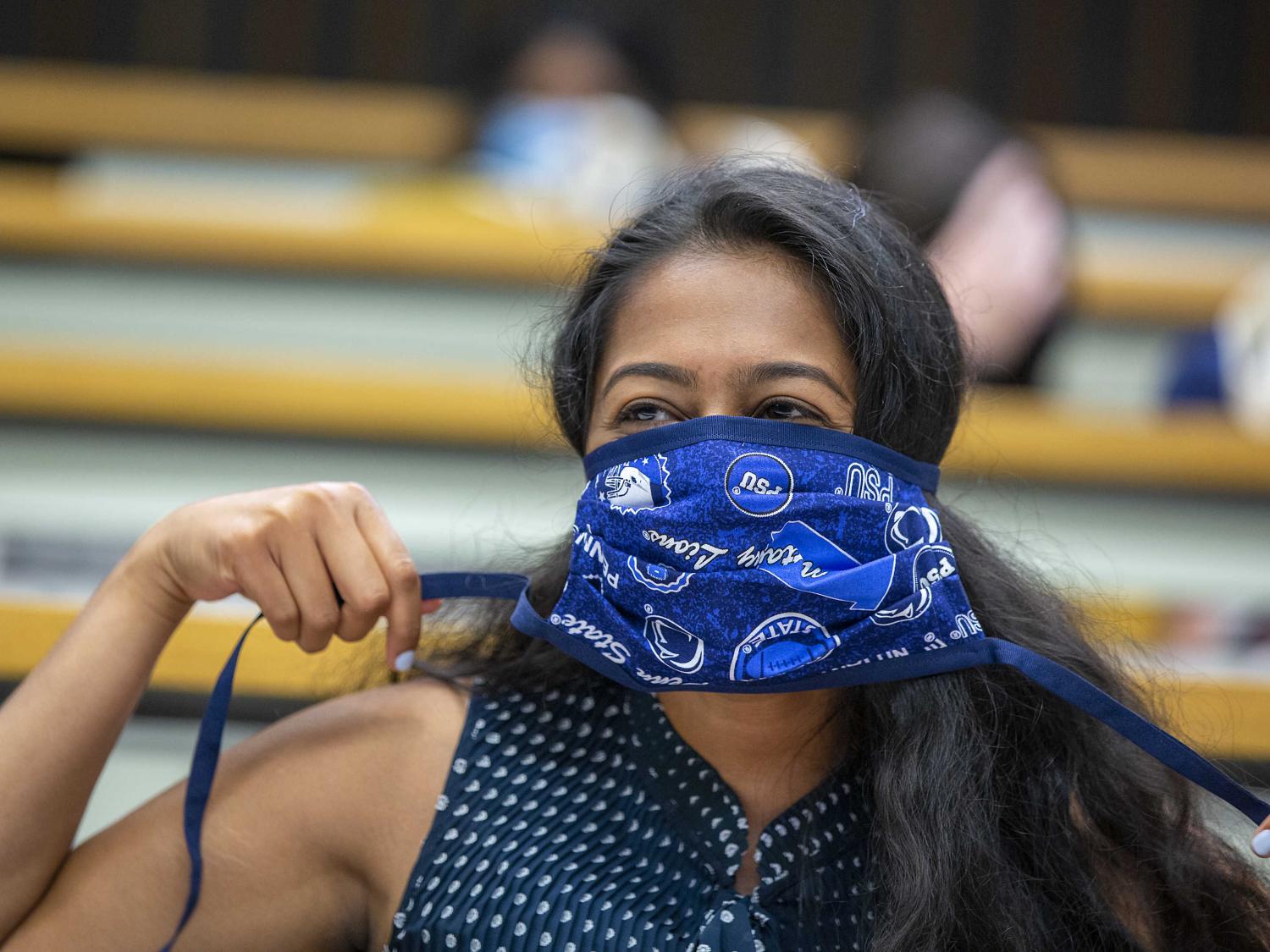 A first-year medical student wears a Penn-State themed mask during the incoming class of 2020 orientation on July 15.