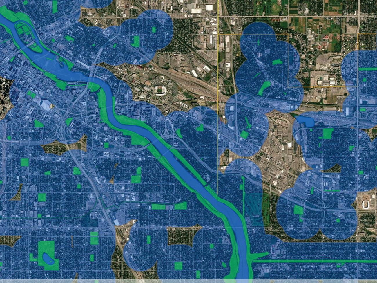 A color-coded map showing satellite imagery of a town with a river running through it
