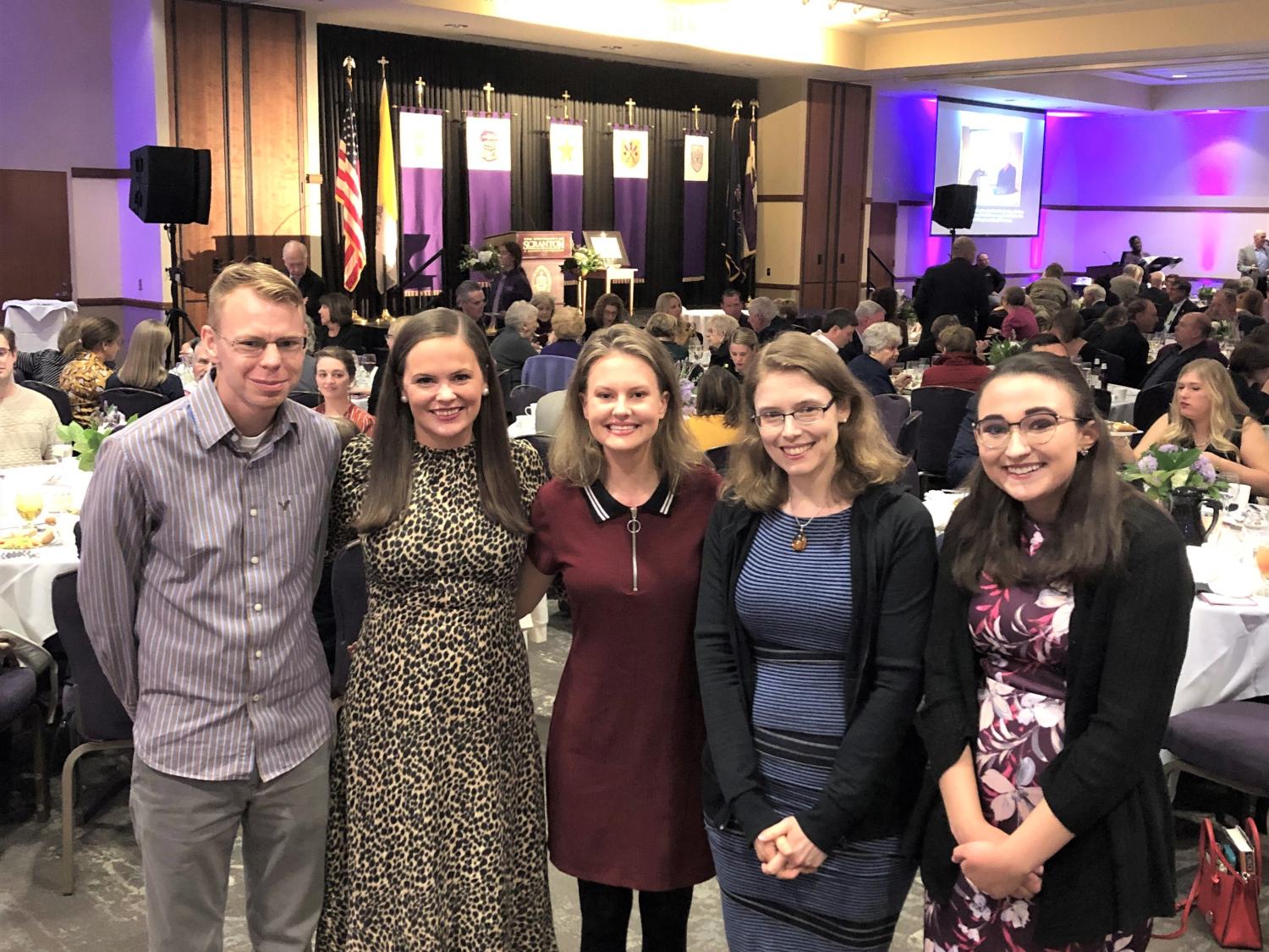 students posing with author Madeline Miller