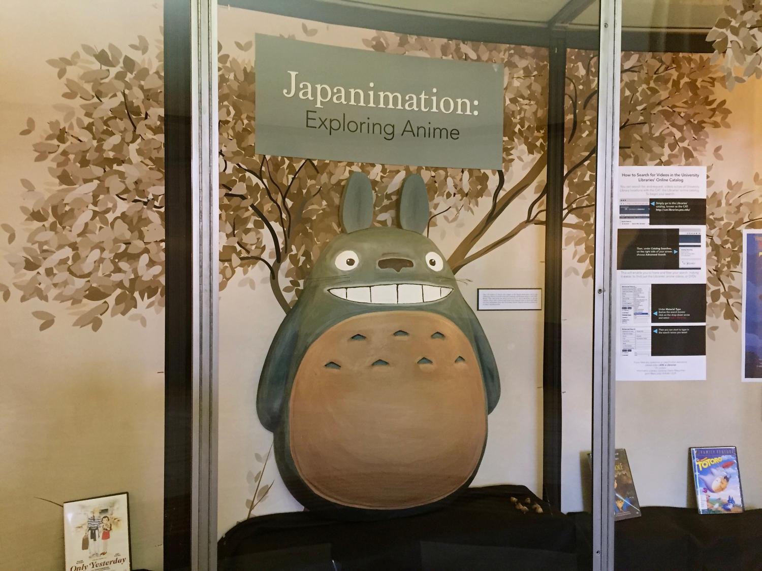 three-dimensional representation of Totoro in an exhibit display case