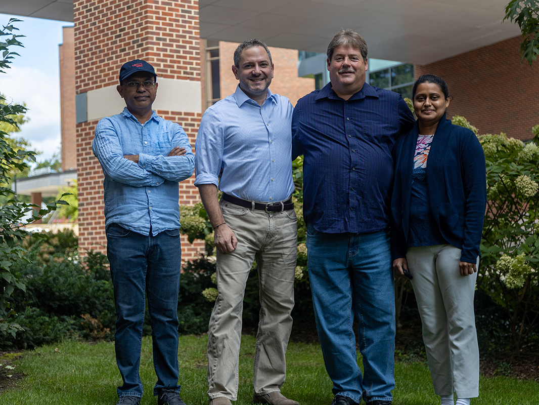​Tapas Mal, Scott Showalter, Larry Johns, and Christy George outside the Chemistry Building