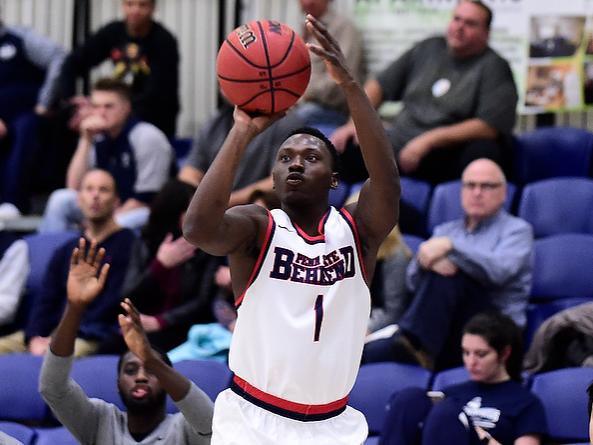 Penn State Behrend basketball player Malike Brinson shoots the ball.