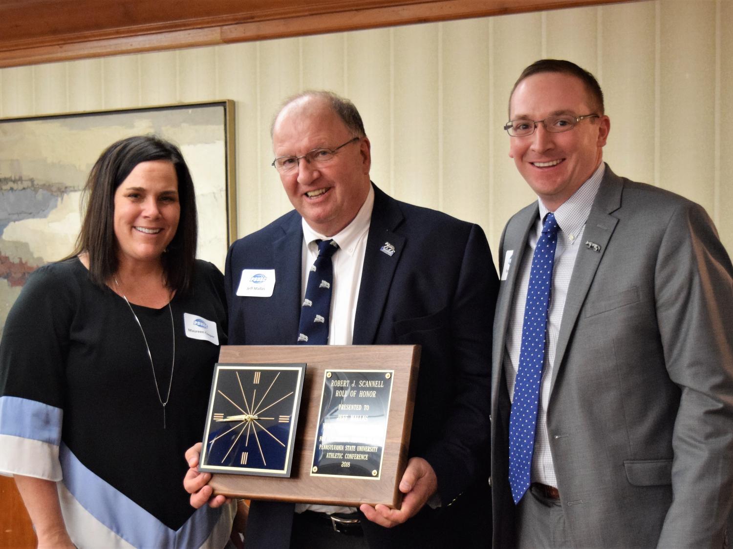 Mallas receiving award