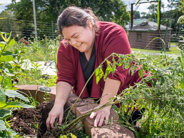 Mary Ann Smith, lecturer of biology at Penn State Schuylkill, cares for native plants on campus.