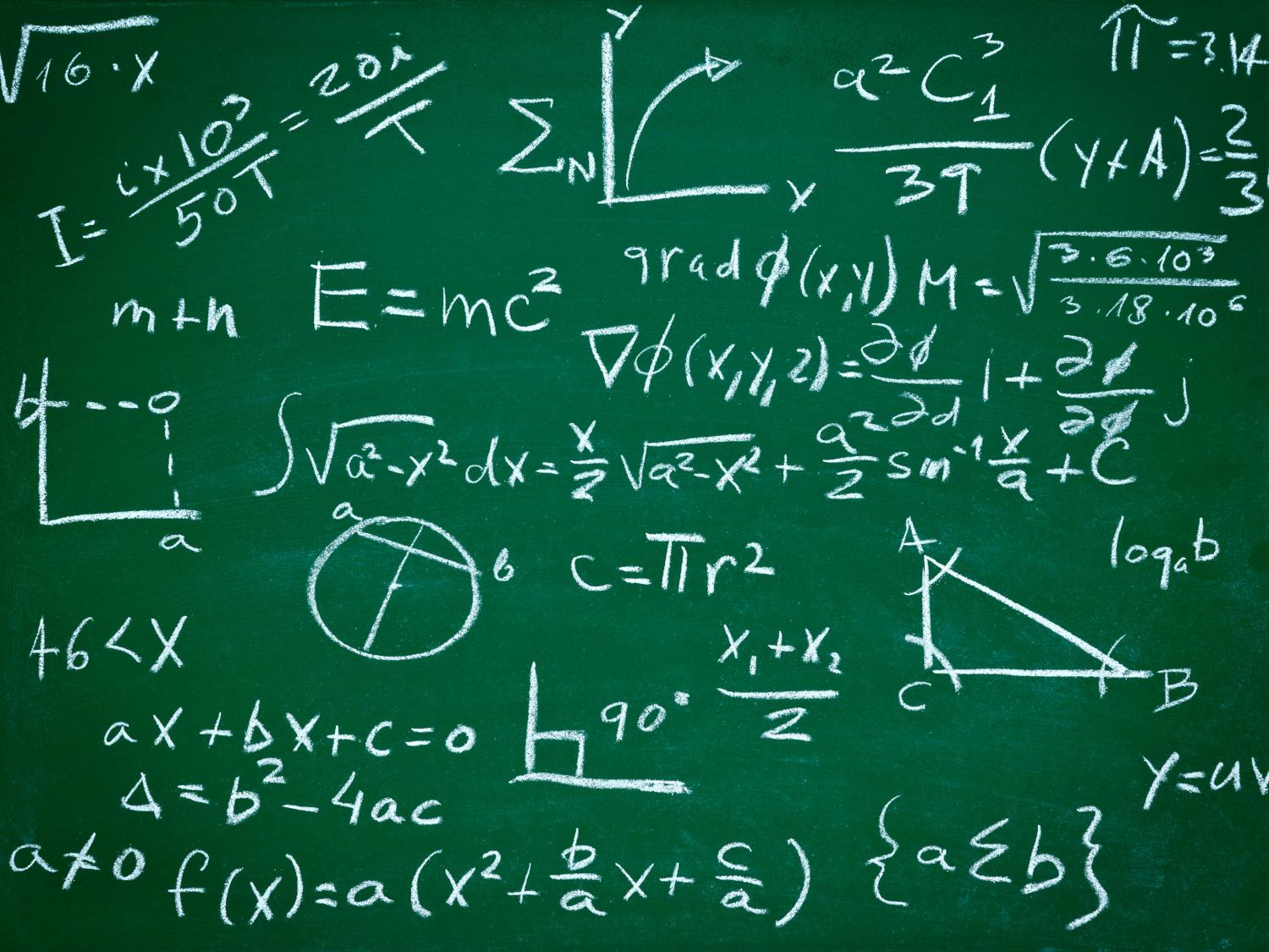 A close-up of math equations on a blackboard.