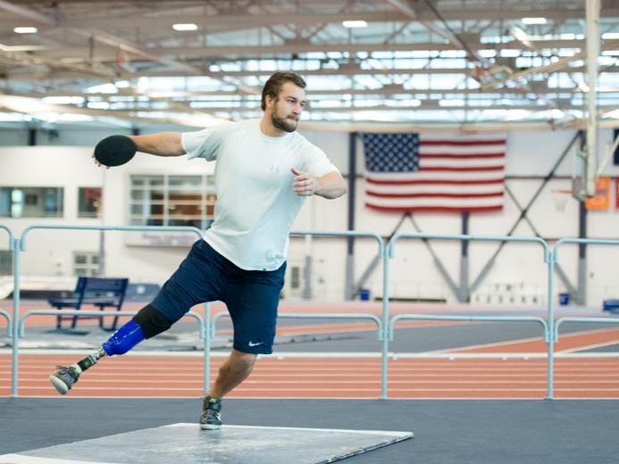 Max Rohn, a member of the Penn State Ability Athletics team, practices with the discus.