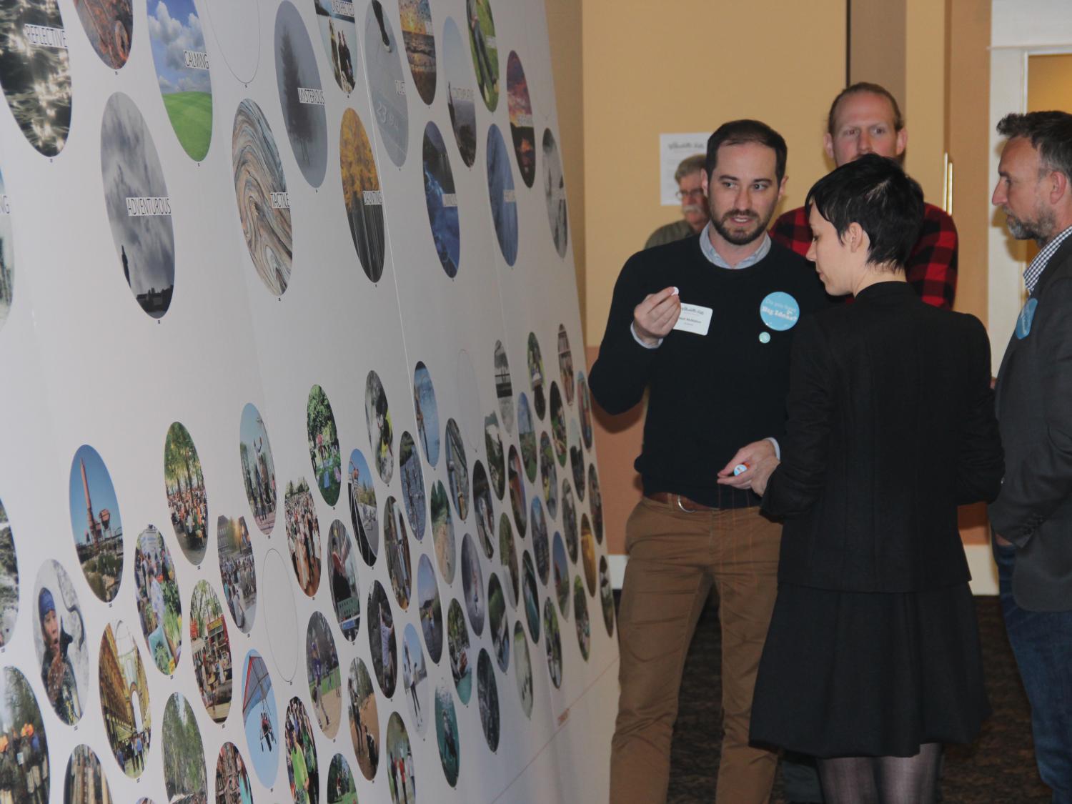 Matt McMahon (gesturing) talks at one of the community engagement meetings for the Willamette Falls Riverwalk project he is working on for Snøhetta's New York office.