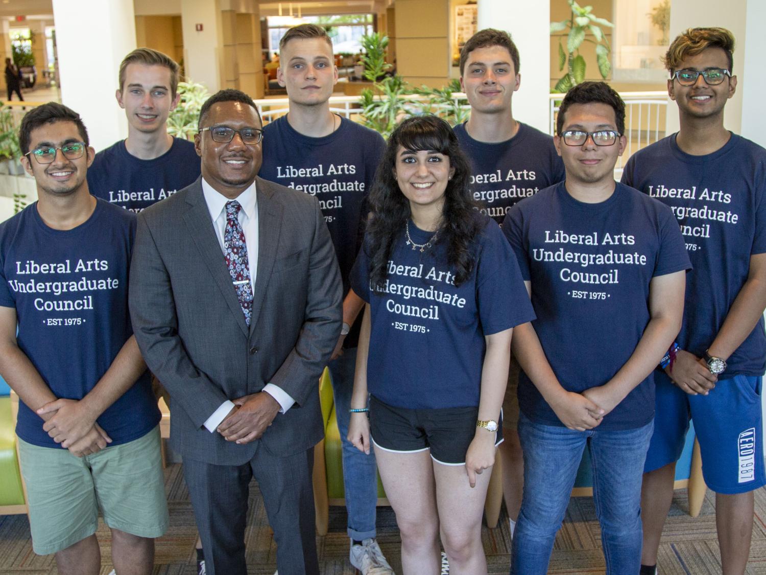Dean Lang stands with seven LAUC members