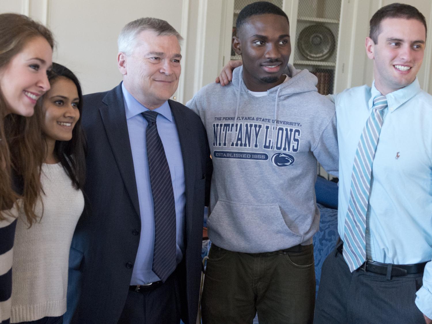 Eric Barron posing with students
