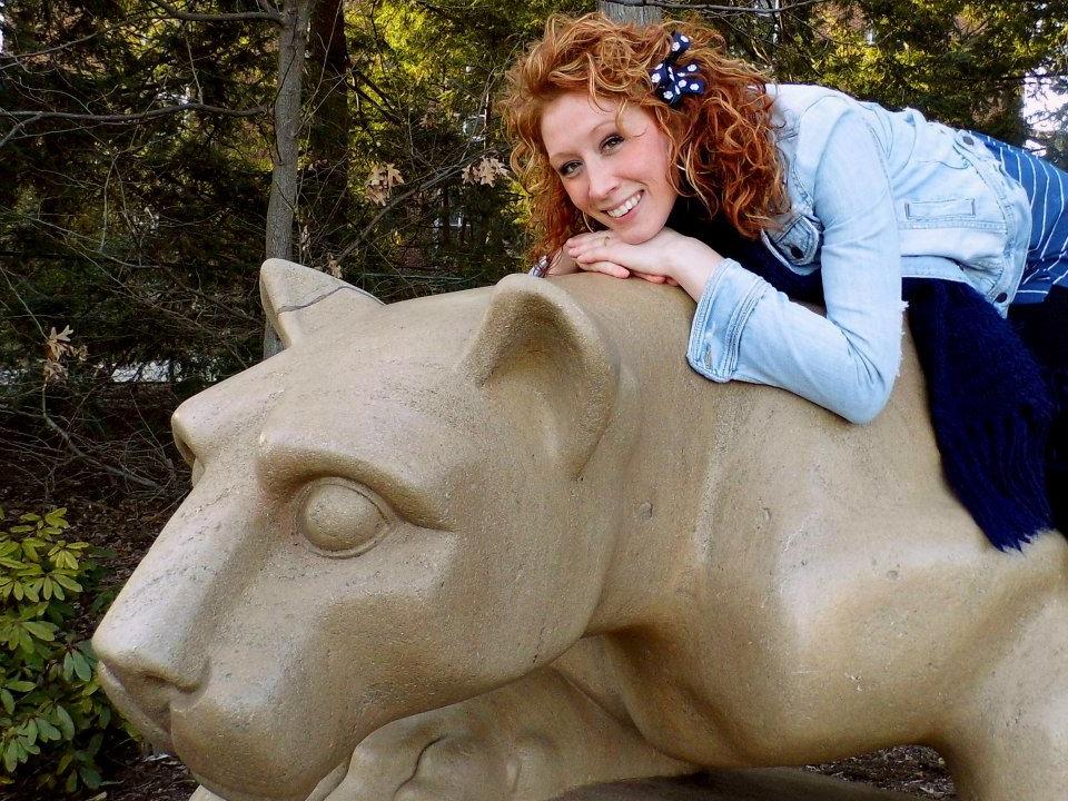 Lehigh Valley campus student Megan Pustaver poses at the Nittany Lion Shrine in University Park.