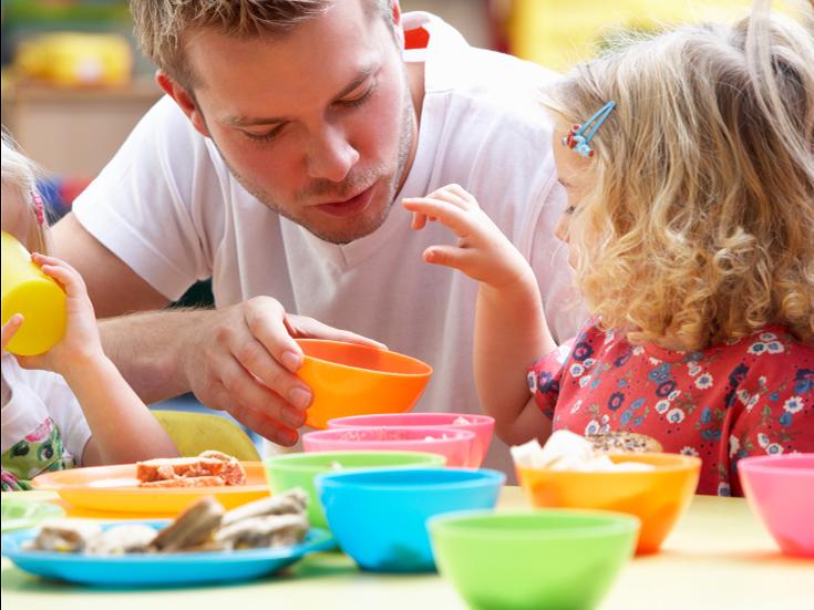dad feeding kids