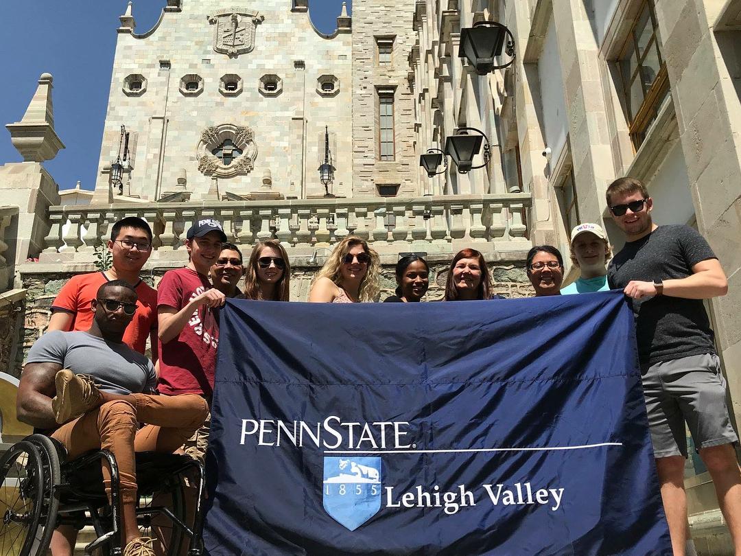 Group of students with PSU-LV banner in Mexico