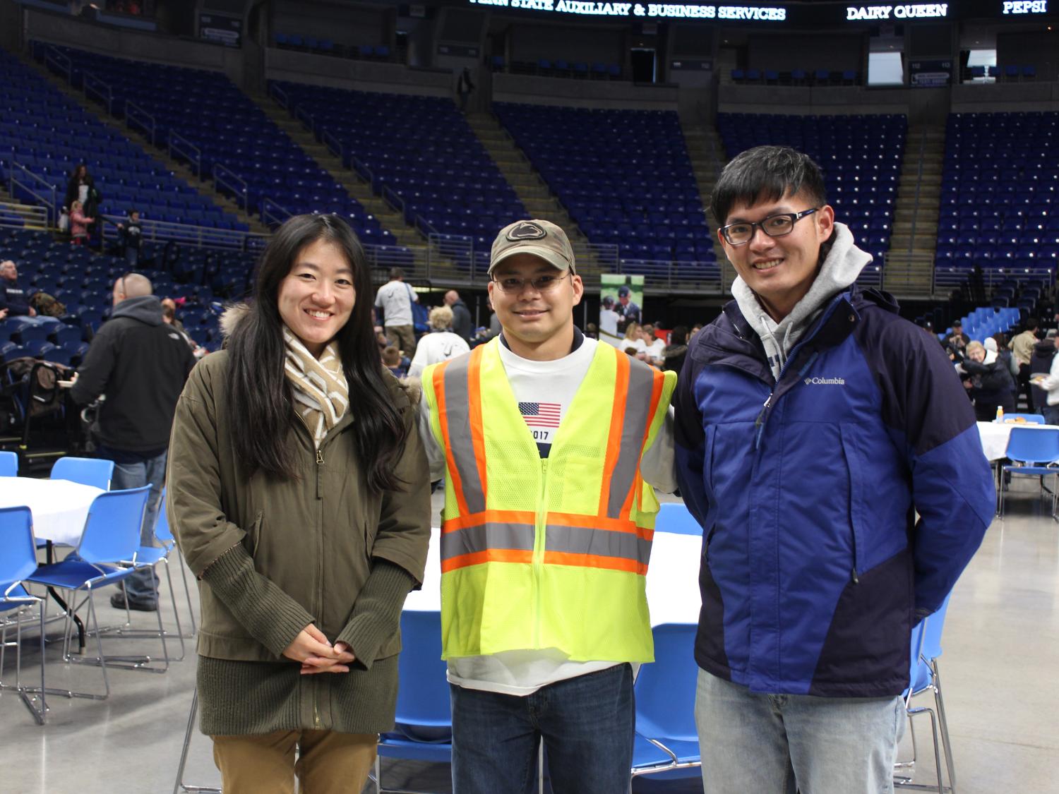 A Walmart representative with two industrial engineering graduate students at the Military Appreciation Tailgate this past fall. 