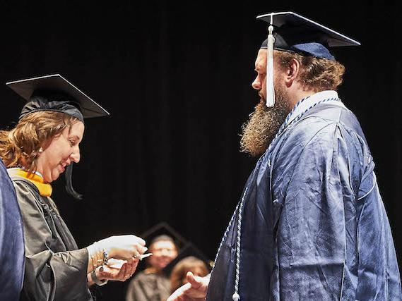 Michael Robinson receives nursing pin
