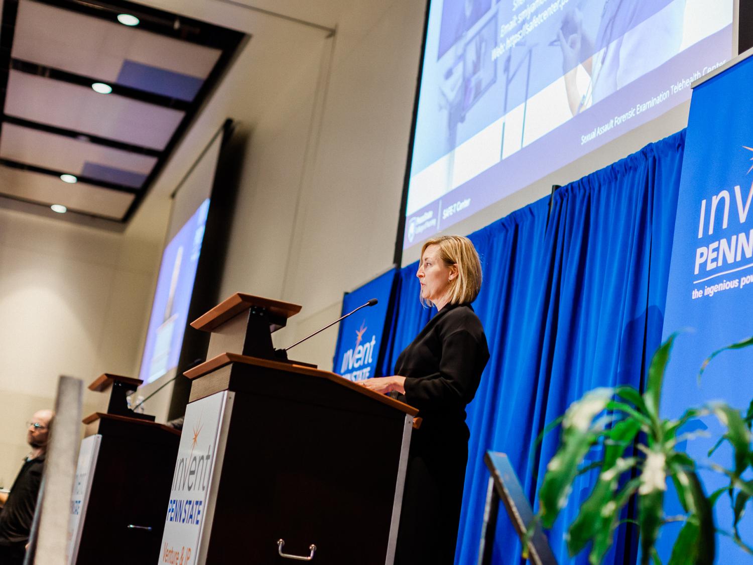 Photo of Penn State faculty member pitching startup idea to panelists