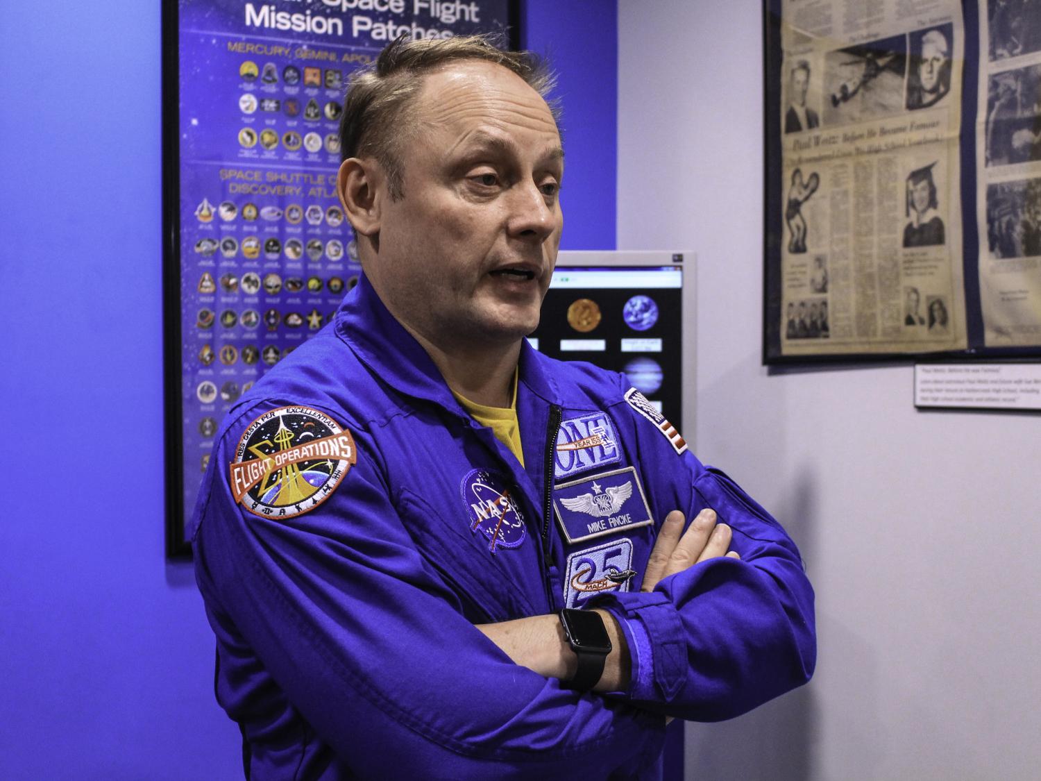 NASA astronaut Mike Fincke talks to a reporter at Penn State Behrend.